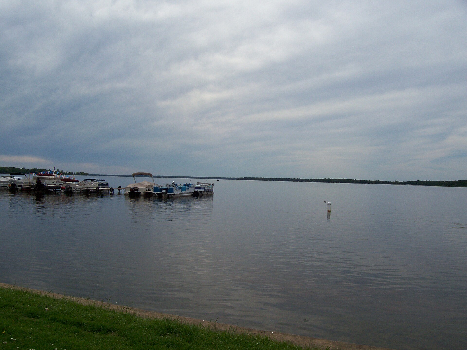 Open water on Shawano Lake with a wooded far shoreline.